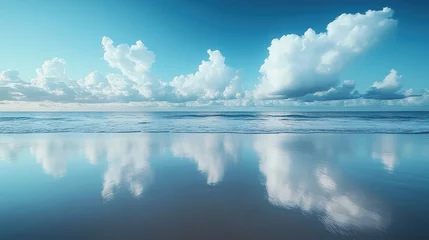 Serene ocean beach reflecting clouds in calm water.