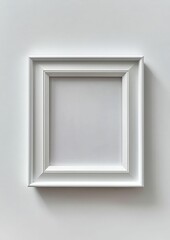 White frame, blank square picture, wall.