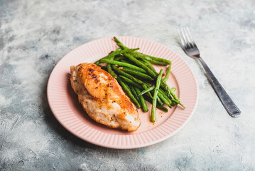 Crispy Chicken Breast Served with Green Beans on Plate