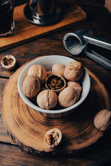 Walnuts in bowl and nutcracker