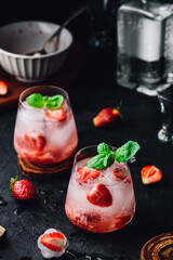Cocktail with fresh strawberry, gin and tonic