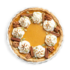 Tasty homemade pumpkin pie in baking dish isolated on white, top view
