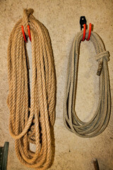 Old coils of rope hanging on a workshop wall  © plazaccameraman