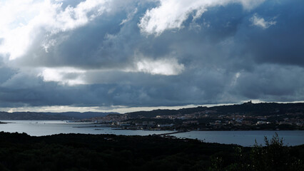 Sailboats and dramatic clouds, evening in the Mediterranean sea, La Maddalena archipelago