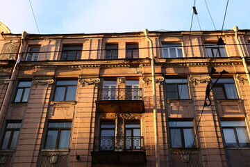 The ornate facade of a residential building showcases splendid architecture and invites exploration