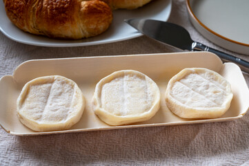Rocamadour or cabecous soft goat AOC cheese with soft rind produced on farm in Perigord and Quercy on farmers market, departement Lot, France