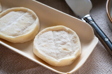 Rocamadour or cabecous soft goat AOC cheese with soft rind produced on farm in Perigord and Quercy on farmers market, departement Lot, France