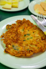 Traditional Andalusian dish from potato and seafood, Tortillitas de Camarones, Shrimp Fritters served in old tavern as tapas, Sanlucar de Barrameda, Spain