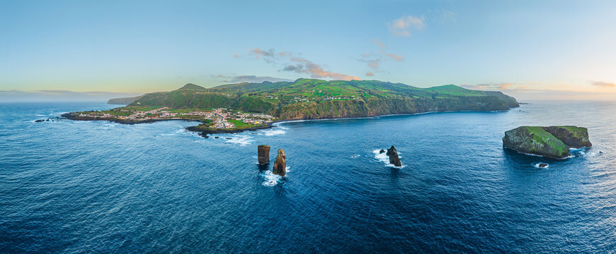 Aerial view on the west side of the isle of Sao Miguel with the village of Mosteiros at sunset, Azores Portugal