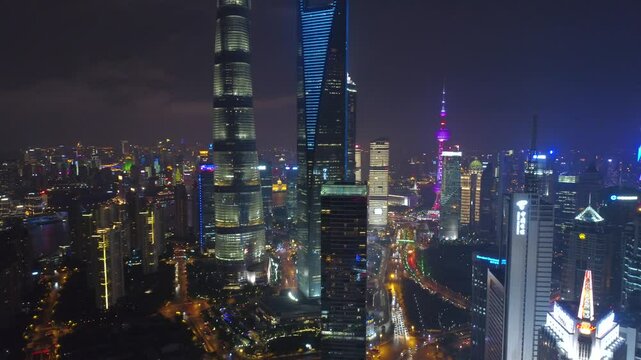 SHANGHAI, CHINA - NOVEMBER 7, 2024: Nighttime aerial view of Shanghai showcasing the vibrant skyline and illuminated skyscrapers