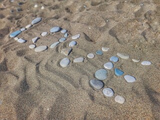 Love inscription made of stones on Aphrodite's beach. Cyprus, Paphos