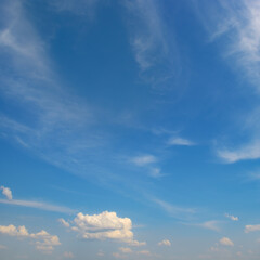 Bright blue sky with white clouds.