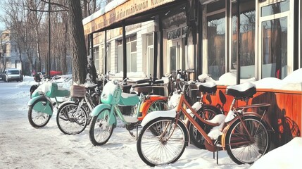 winter charm: snow-covered bicycles at an eco-caf&eacute; - perfect for inspiring sustainable transportation in your sports interior poster!