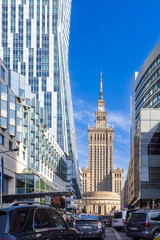 Obraz premium WARSAW, POLAND - June 18, 2024: The streets are the Orco Tower skyscraper, the Palace of Culture and Science, Golden Terraces on Zlota Street.