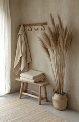 Cozy neutral space with natural decor featuring towels, dried plants, and minimalist design elements in a serene