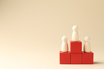 Competition concept. Human figures on wooden cubes against beige background, space for text