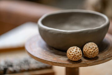 Vintage Crafting Tools for work with clay and Accessories Amidst a Rustic Table 