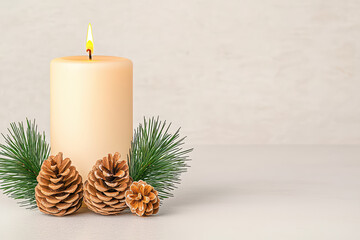 warm candle surrounded by pinecones and greenery creates cozy atmosphere