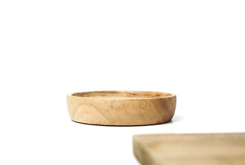 Small wooden plate is facing up. suitable for putting food products, bottles, and more. isolated on white background.