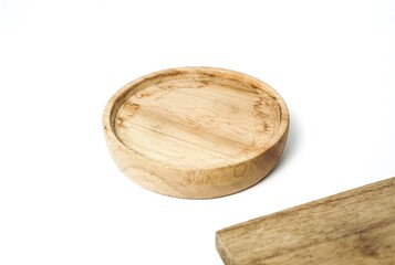Small wooden plate is facing up. suitable for putting food products, bottles, and more. isolated on white background.