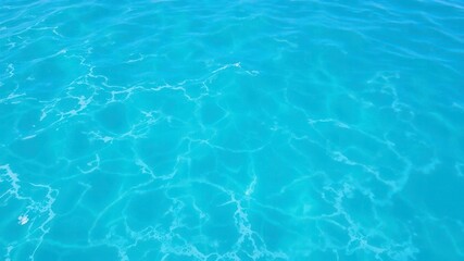 Obraz premium Pure blue turquoise water texture of the ocean sea with foam and waves, sea, beautiful, ocean