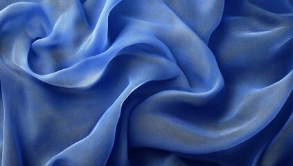 Fototapeta premium Blue silk fabric draped in soft waves.