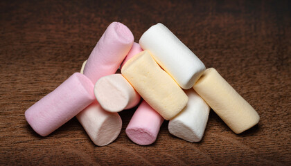 Marshmallow. A pile of mini marshmallows on a wooden surface. Selective focus
