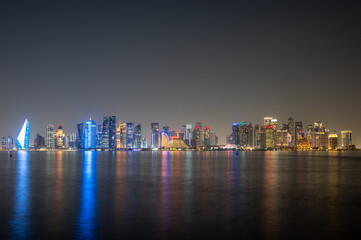 Obraz premium Doha city skyline illuminated at night. Qatar, Middle East