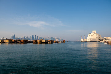 Naklejka premium Dhow near West bay sky scrapers and Museum in Doha
