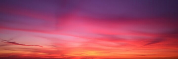 Painted sky with vibrant hues of orange, pink, and purple during sunset, background, vibrant