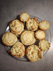 Delicious homemade pastries with cottage cheese filling on glass plate copy space
