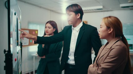 Professional business team analyzing performance metrics through charts and graphs, showcasing collaborative teamwork and innovative problem-solving approach during strategic meeting