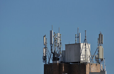 Top of a tower with communications antennas installed on top, technology