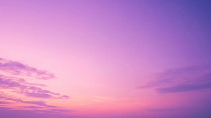 Soft pastel purple and pink sunset sky with clouds.