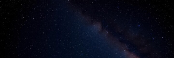 Fototapeta premium Night sky with stars sparkling on a deep black background, milky way, dark, sparkling