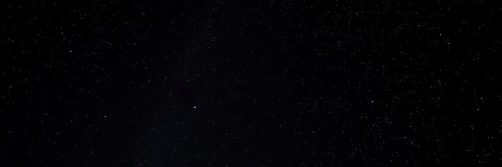 Fototapeta premium Night sky with twinkling stars against black background, nebula, Milky Way