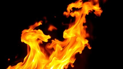 Fiery orange and red flames billowing against a stark black background, intense, backdrop