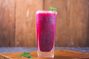 dragon fruit juice on a wooden background