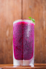 dragon fruit juice on a wooden background