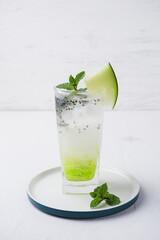 ice melon nata de coco, a drink with a cold sweet taste consisting of a mixture of melon syrup, melon fruit, nata de coco, basil seeds and soda