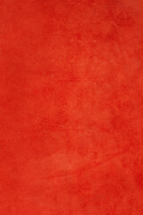 Red suede background macro photo.