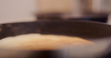 Close-Up of Couple While Baking Pancake in Pan