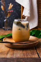 a glass of grass jelly ice, a popular drink during Ramadan