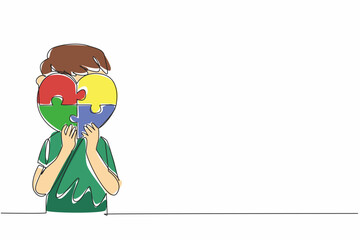 Single continuous line drawing boy holding a heart shaped 4 piece puzzle. Symbolic. Non verbal expression. Needs excessive affection. World Autism Awareness Day. One line design vector illustration