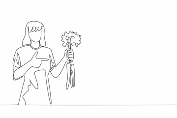 Continuous one line drawing woman holding some carrots with the tips of the leaves still thick. Source of vitamins and minerals. International Carrot Day. Single line draw design vector illustration