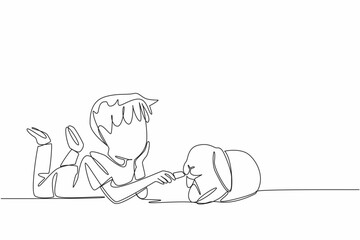 Single one line drawing boy prone to feeding carrots to rabbit. Casually caring with full affection. Favorite food. Stay healthy. National Farm Animals Day. Continuous line design graphic illustration