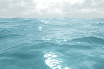 Calm ocean waves under a cloudy sky.