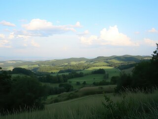 Obraz premium Lush green meadows and rolling hills under a clear blue sky, peaceful, beauty, idyllic