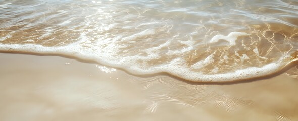 Obraz premium Ocean Waves Gently Crashing on Sandy Shore, Creating a Serene Coastal Scene at Dawn