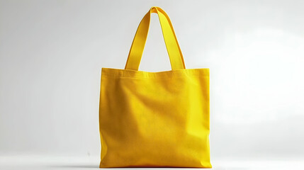 A bright yellow tote bag displayed against a neutral background, showcasing its simplicity and utility.